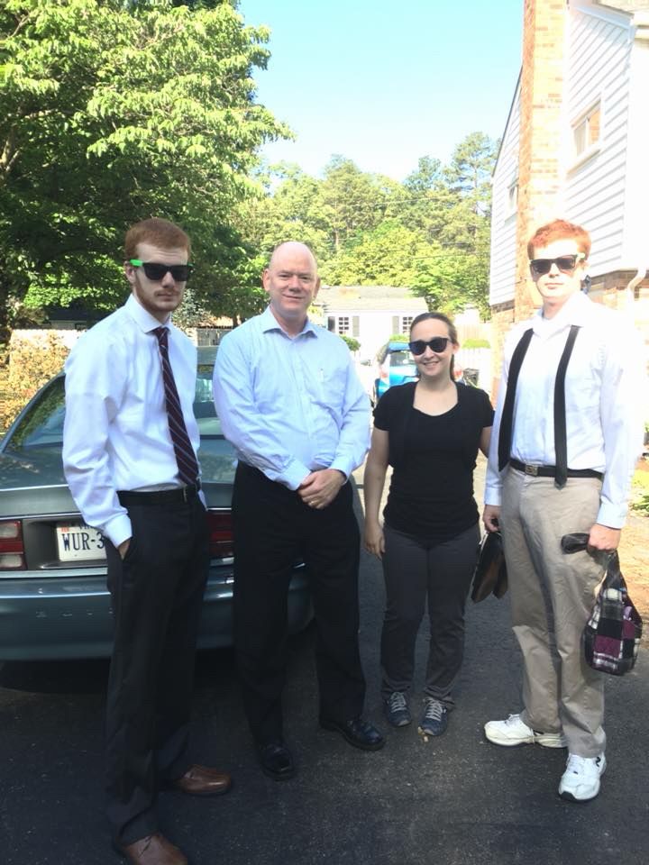 2 young men w/ ginger hair & young woman kind of dressed up, older bald man. 