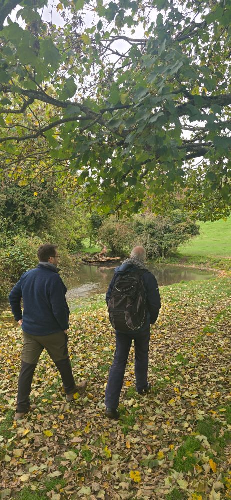 Two men walk beside the Hughenden stream