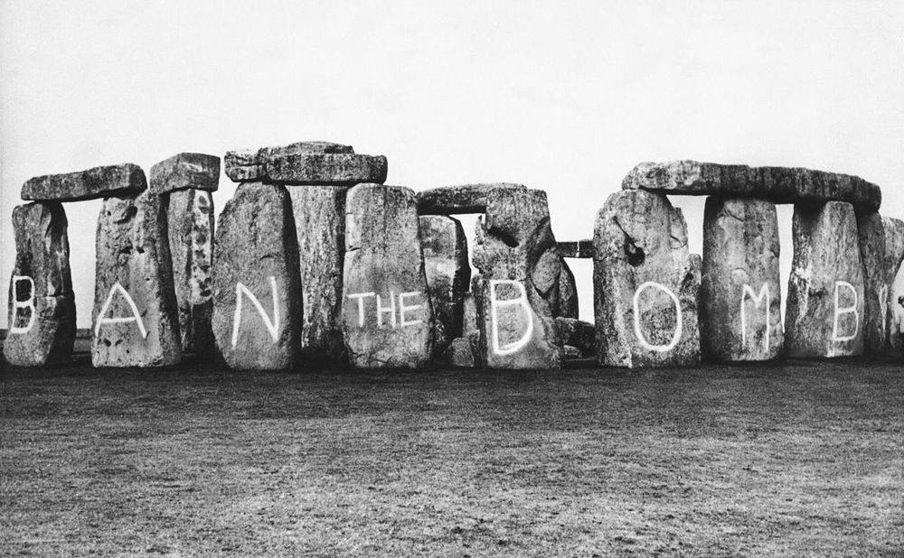 Black and white photo of Stonehenge, defaced with the words 'Ban the Bomb', March 1961