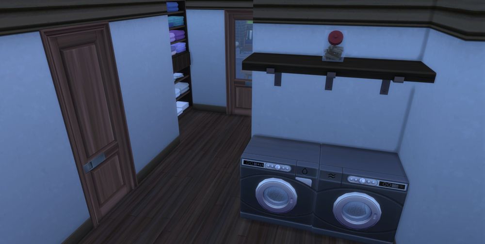 a basement laundry area with a door leading outside to the hot tub area.