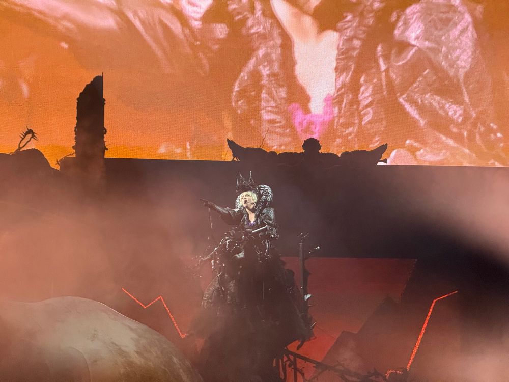 Lady Gaga on a giant black pedestal 