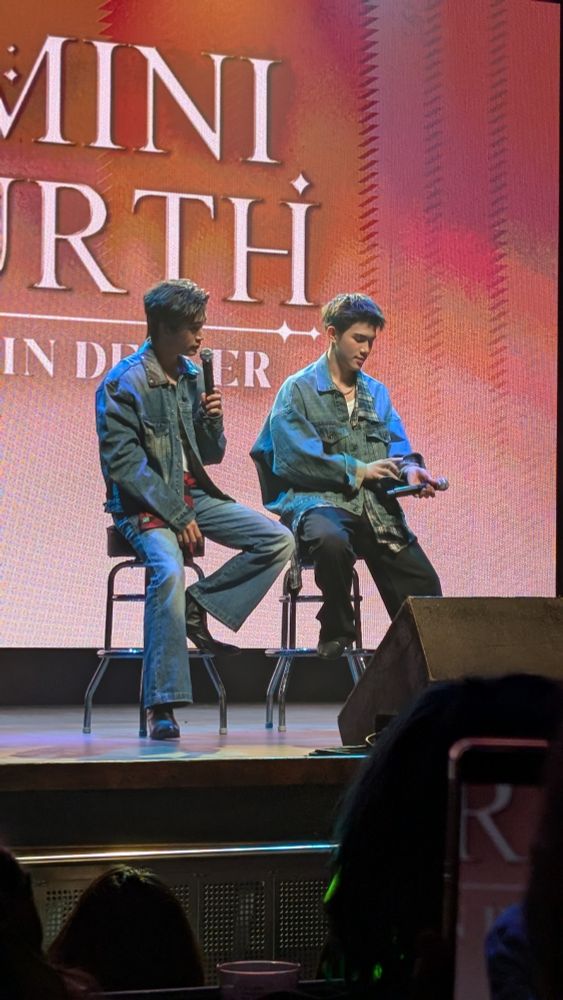 GeminiFourth during their Denver fan meet. Both wearing jean jackets with pants. 