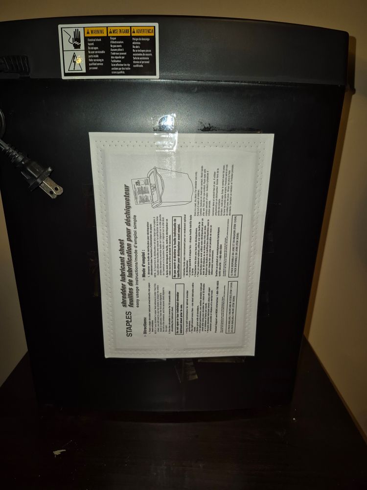 Paper shredder lubricant sheet taped to the back of it 