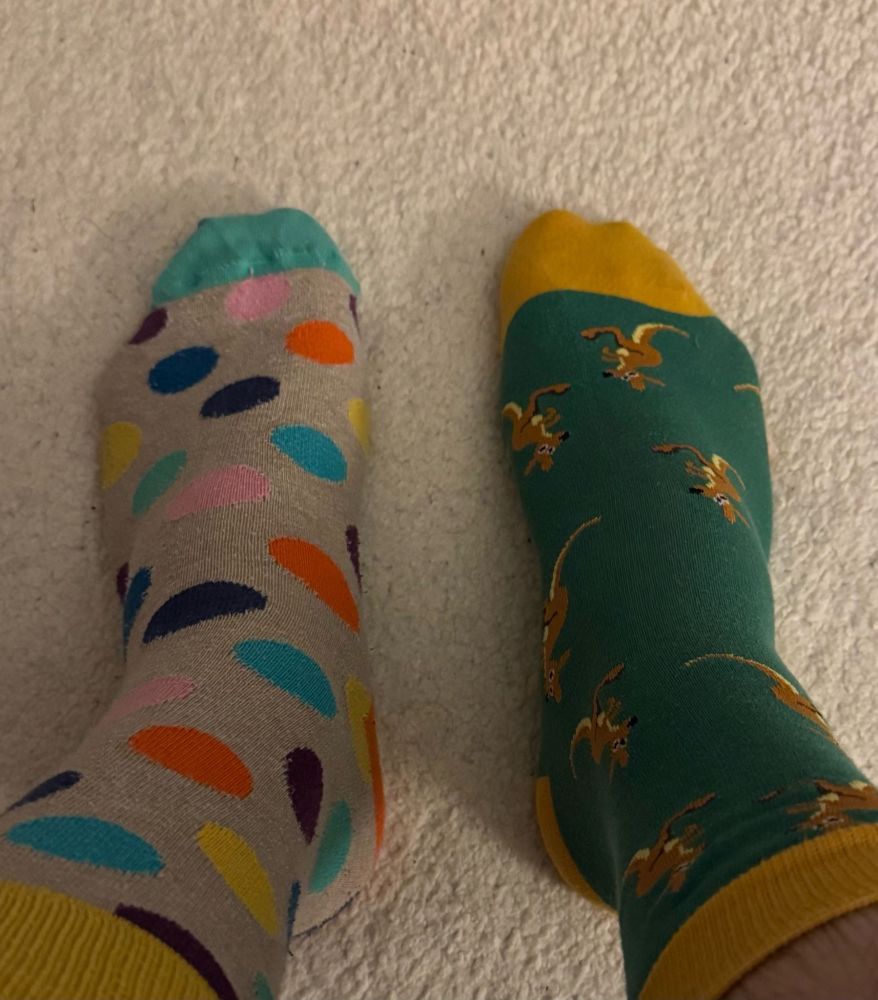 Paul O’Kane’s feet. He is wearing odd socks.