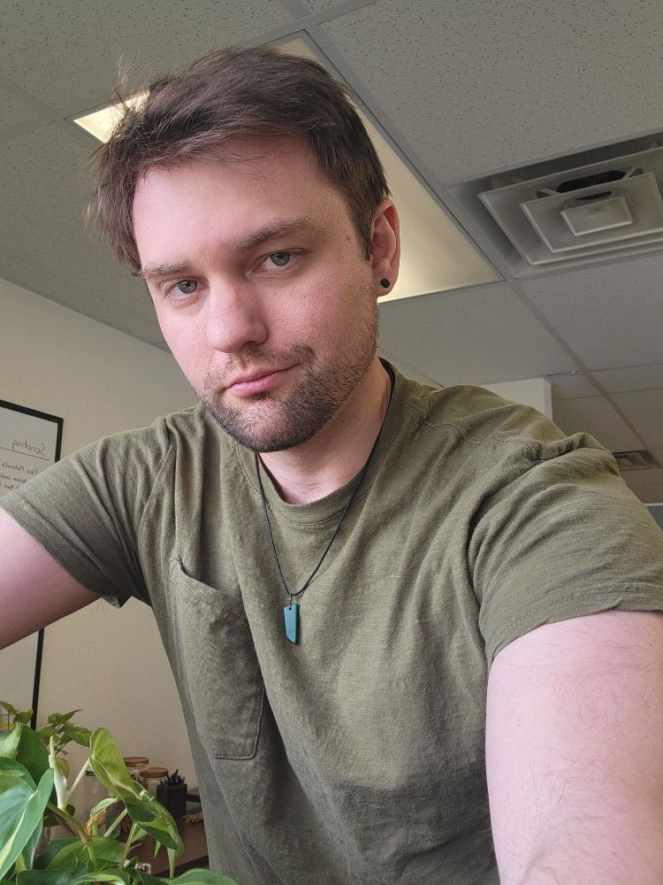 When you're bored at the office, you try and take selfie. Occasionally they actually look good.