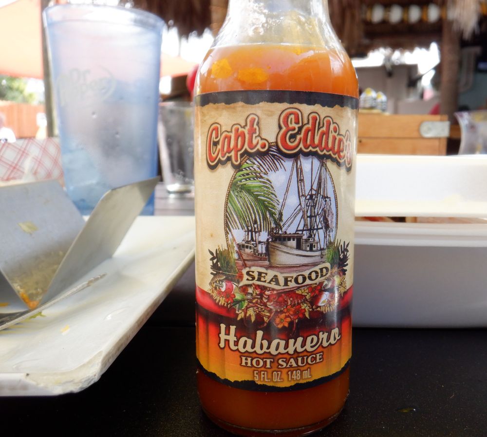 Photo of a bottle with a label that says: Capt. Eddie's Seafood Habanero Hot Sauce. 