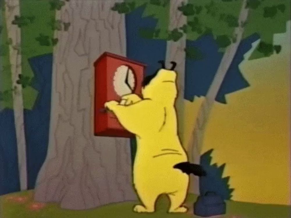 a cartoon dog is looking at a red clock on a tree