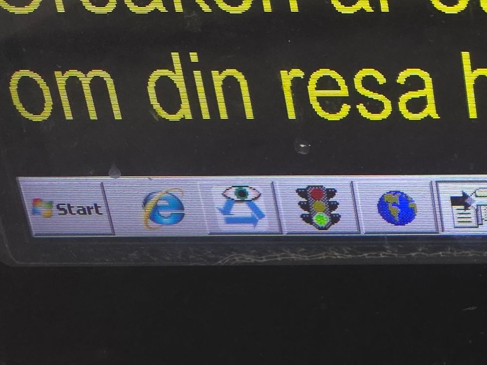 Photo of train info display showing a Windows NT Start button