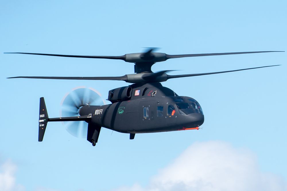 Photo of the flying SB-1 Defiant prototype from Lockheed/Sikorsky for Future Vertical Lift. It has coaxial rotors and a pusher prop at the rear.