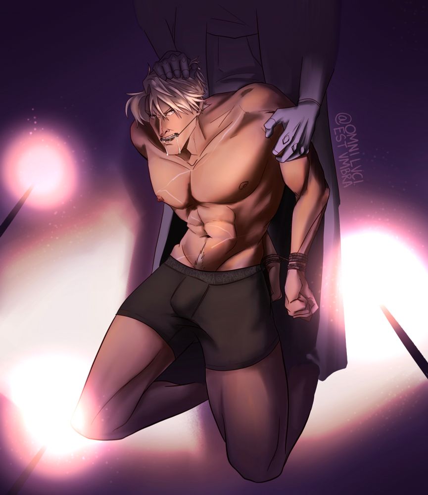 Captured Draco kneeling in a spotlight with wands aimed at him. His hands are bound and he’s gagged with someone standing behind him holding his arm and hair. 