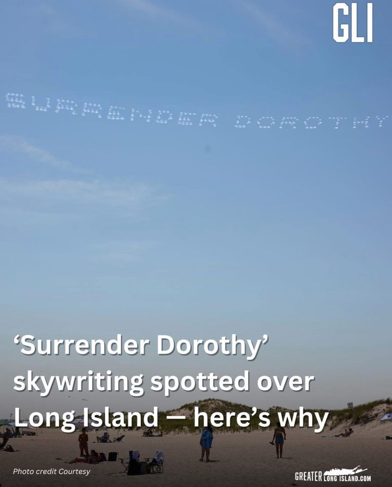 Screenshot of a news story with the headline “Surrender Dorothy skywriting spotted over Long Island - here’s why” with a picture of said skywriting. 