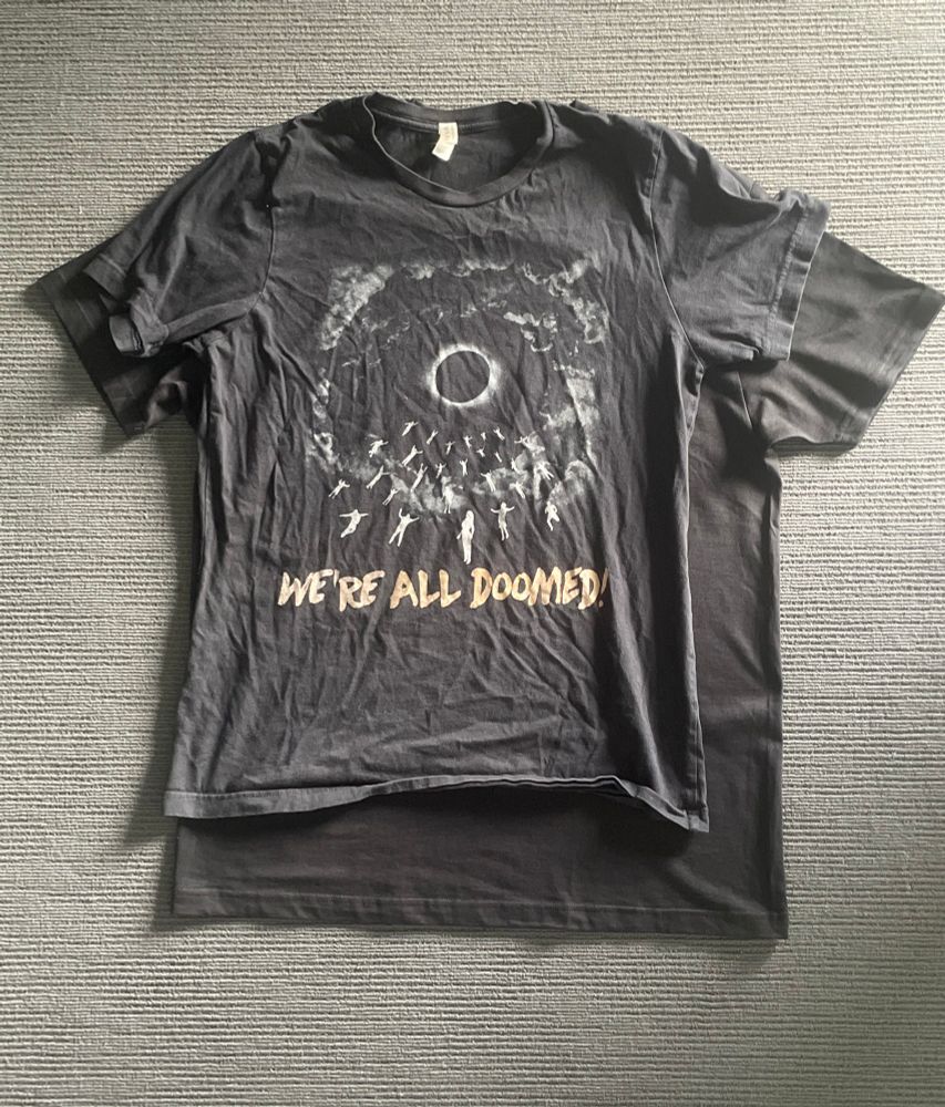 wad shirt laying over hard launch shirt looking at least two sizes smaller 