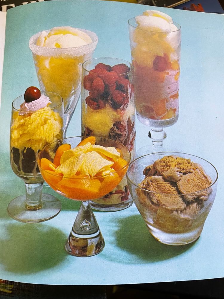 Photo from a 1970s recipe book showing various ice cream sundaes in cocktail dishes