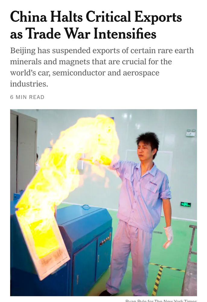 A NYT headline about China halting crucial exports. The picture, however, is a man opening a hatch on a machine and a bright yellow, uh, flame? Blob? Incorporeal entity? is escaping containment 