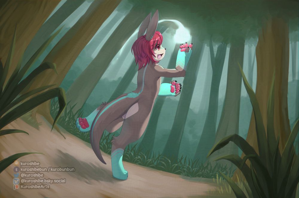The camera is tilted. Stray grass frames the image in the foreground. There is a clearing in the forest where Trimo, a furry character with red hair and various teal markings, is seen happily playing with a wisp of light that is flying around them. Trees and bushes can be seen in the background surrounding them.
