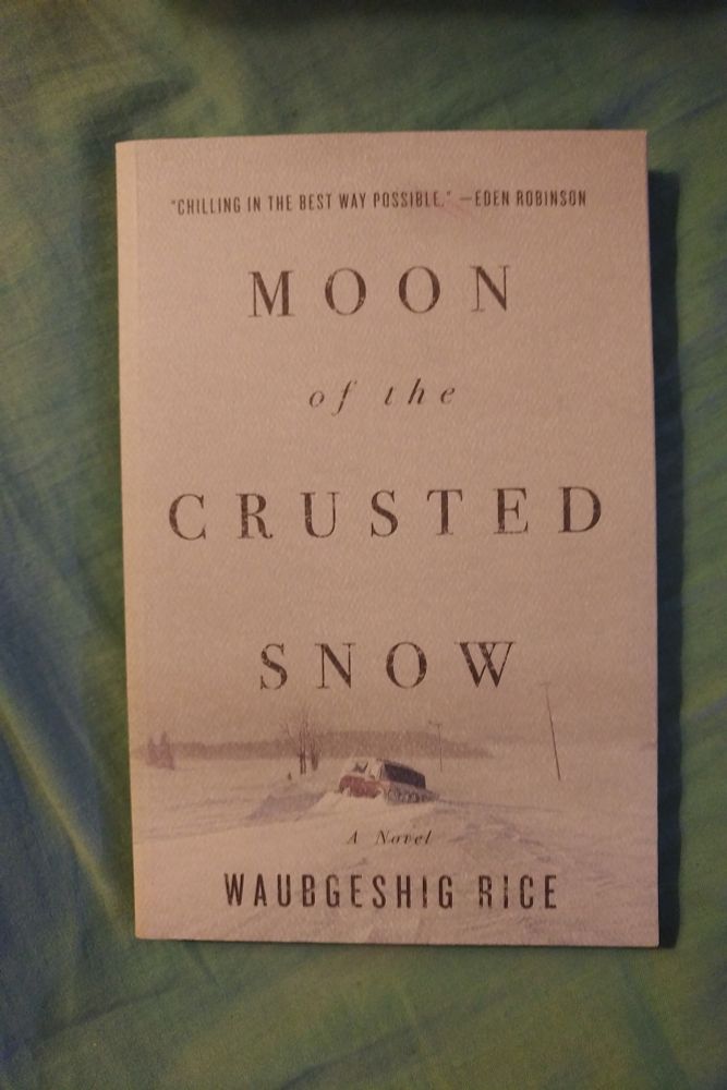 Moon Of The Crusted Snow by Waubgeshig Rice

A white paperback book with an image of an old SUV stuck in a snow bank on a bleak, white, wintry landscape.

"Chilling in the best way possible." - Eden Robinson.