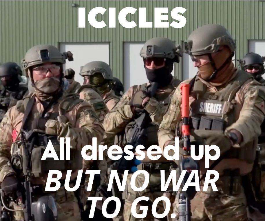 A photo of men presumably ice agents, in full military gear and weapons visible. Text is added that says “icicles all dressed up, but no war to go.”