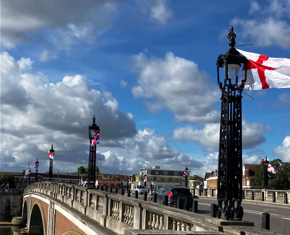 Hampton Court Bridge festooned with cheap Poundland St George’s and Union flags 