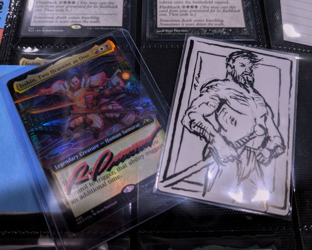 A picture of two magic the Gathering cards. One is the front of a foil Isshin, Two Heavens as One. It is signed in red and black. The other is the back of an Artist Proof of the same card. It has a signed sketch of the character wearing only a fundoshi.
