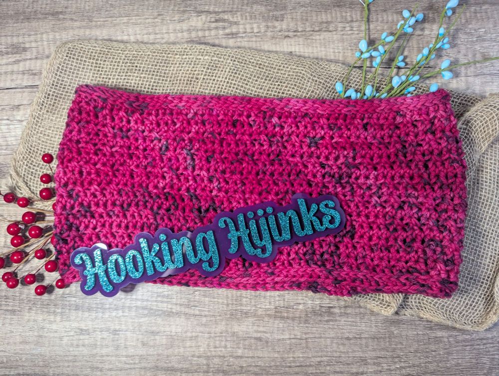 A crocheted cowl that is hot pink