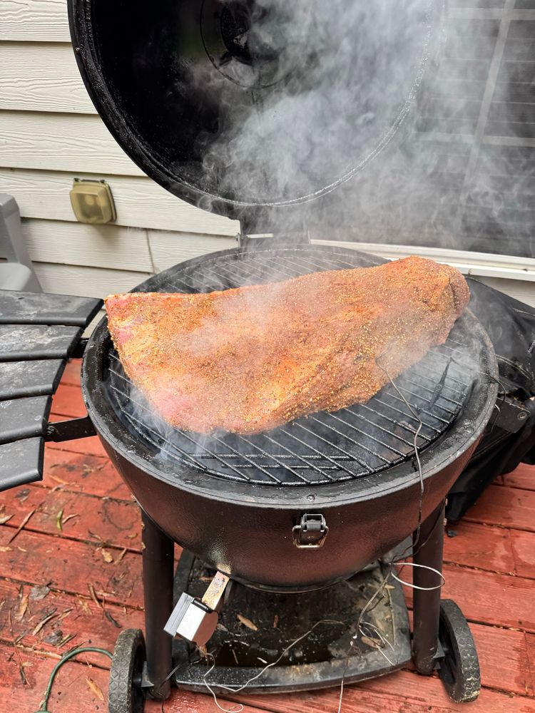 Brisket on the pit, in the smoke. 