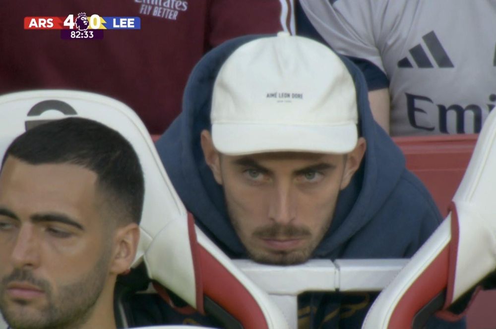 Kai Havertz looking sad with his head resting on the seat rest in front of him