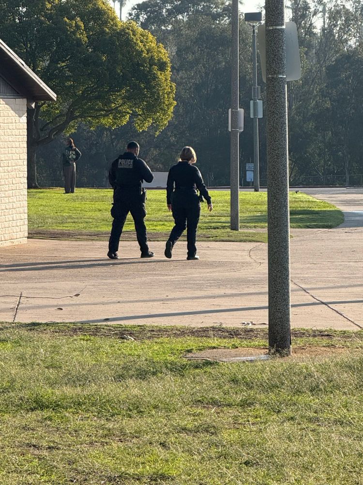 Border patrol agents walking at Morley field park in San Diego 