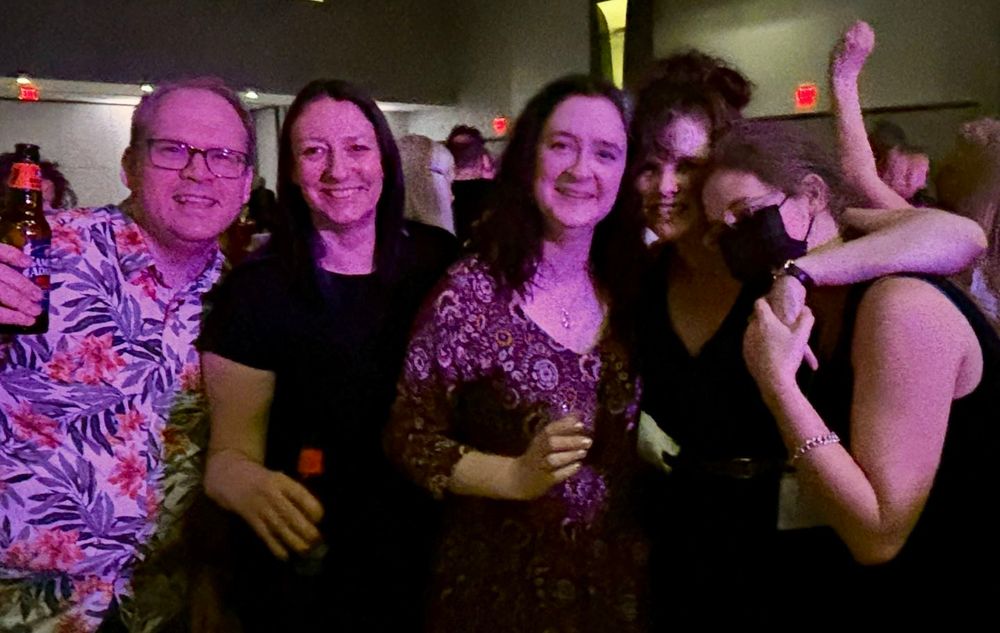 Five tired Shakespeareans of various genders, on a dance floor