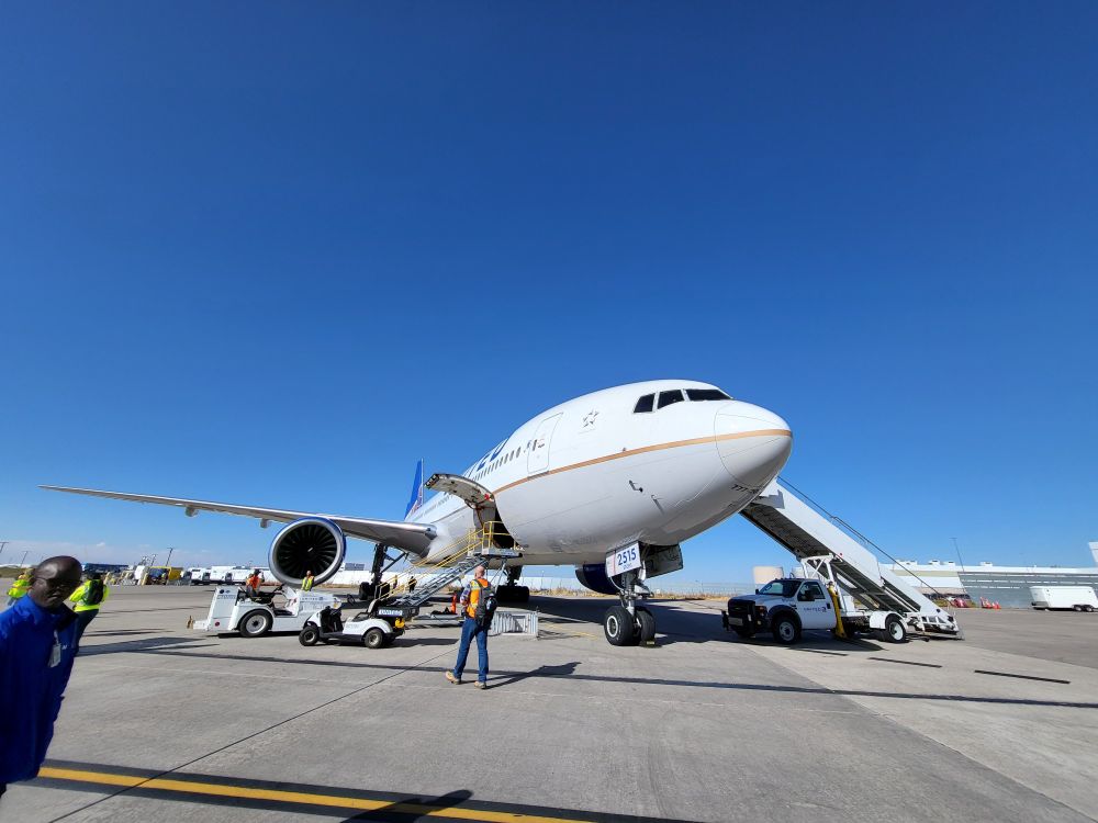 A shot of a 777-200 with a human and ground equipment for scale.