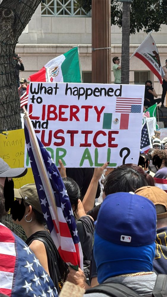 A protest sign that reads: “what happened to liberty and justice for all?”