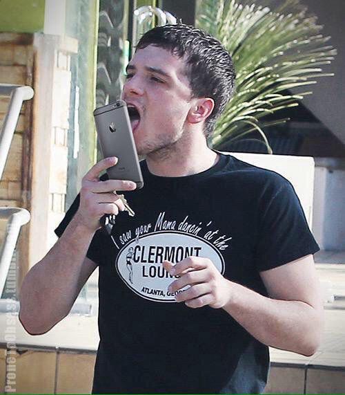 Picture of Josh Hutcherson licking his phone screen