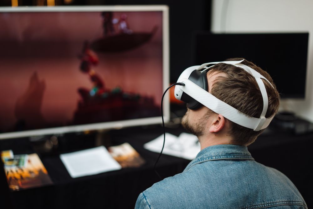 A man wearing a VR headset experiencing an installation at the festival