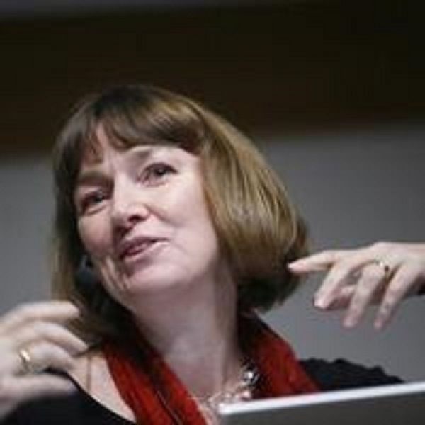 Photograph of Kristina Höök, a white woman with bobbed light brown hair giving a talk. She is wearing a black top and red scarf.