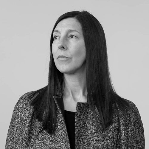 Black and white photo of Prof. Jane Harris, a white woman with long dark hair, looking away from the camera