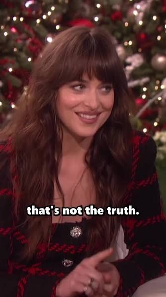 Dakota Johnson on the Ellen show, smiling politely and barely raising a correcting finger as she's about to destroy Ellen's life and reveal her to be a weirdo narcissistic liar.