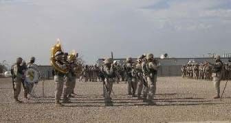 1st Cavalry Division Band performing in ceremony for 256th Tiger Brigade wearing full U4, and carrying weapons. Camp Victory North, Baghdad Iraq January 2005.
