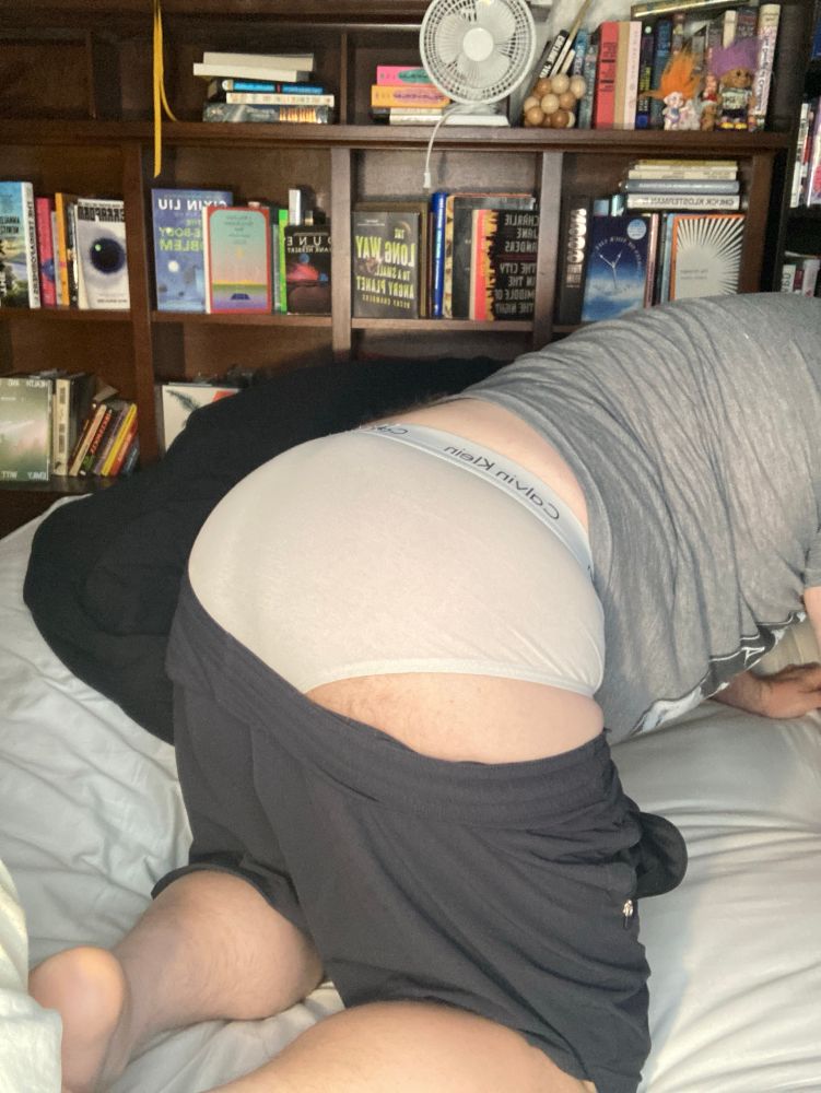 My ass, bent over, clad in white briefs