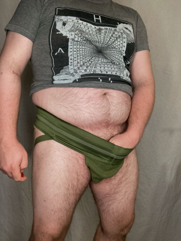Me with my hands down the front of my green jock, showing tummy
