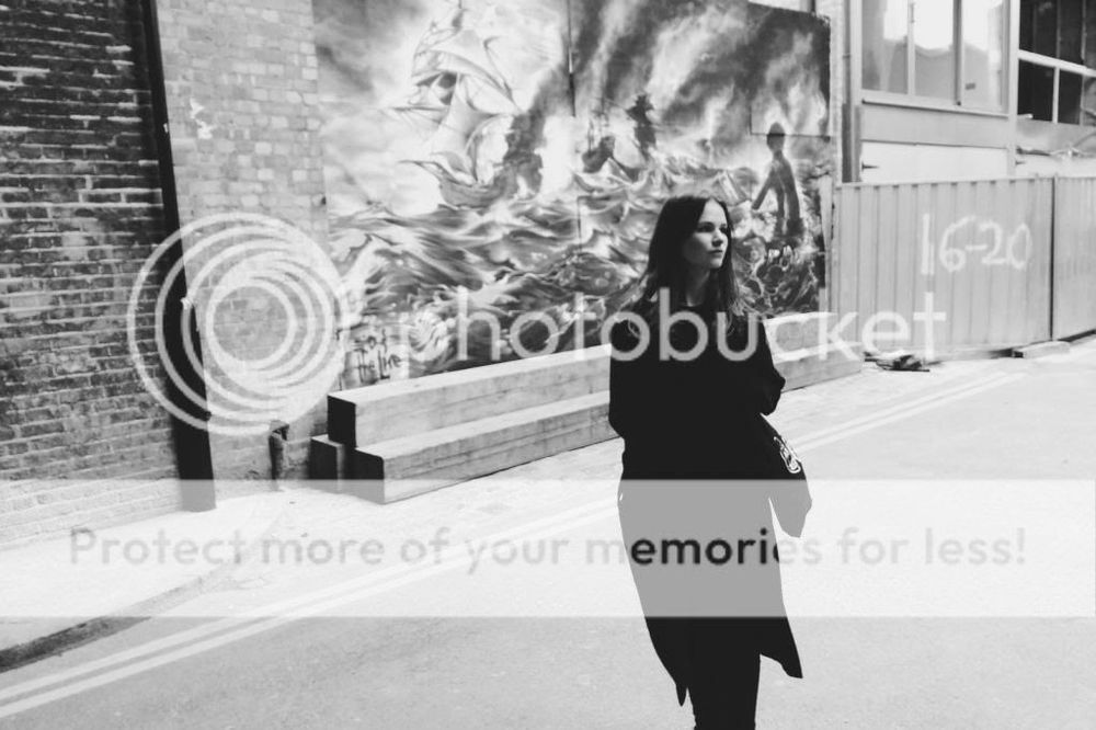 A black and white picture of me in London. A giant Photobucket watermark is obscuring most of the image. 