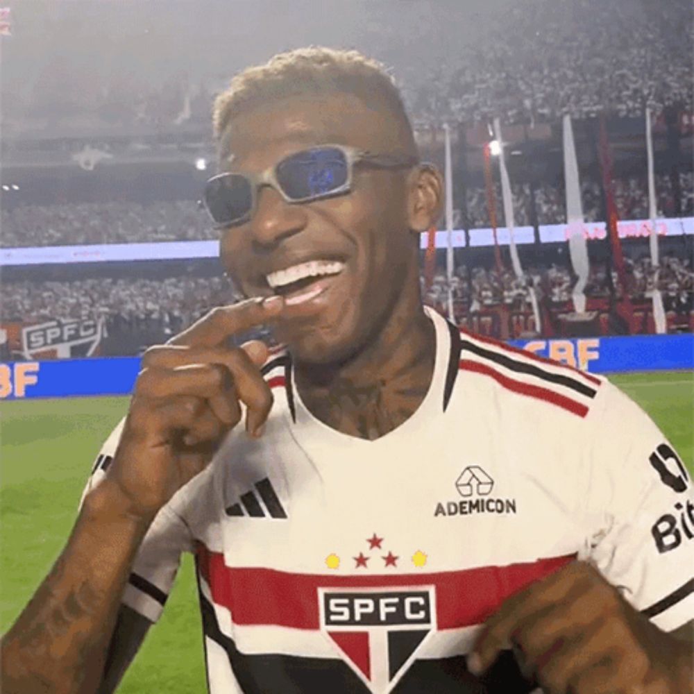 a man wearing sunglasses and a jersey that says spfc on it