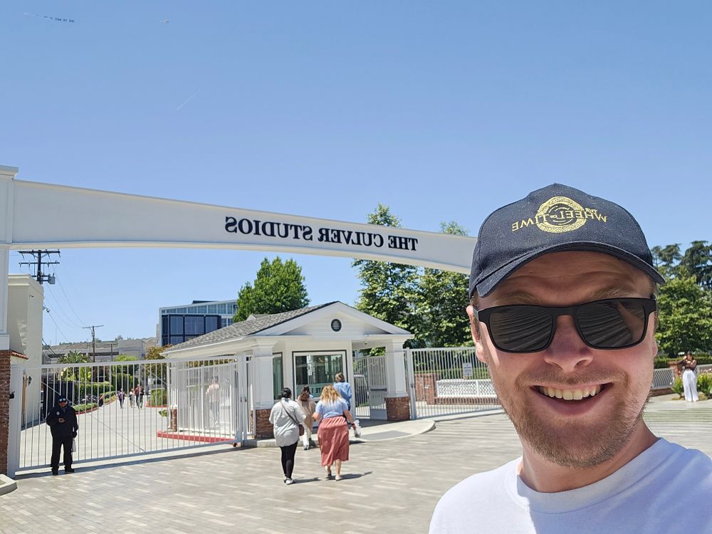 Gus in his wheel of time hat in front of the Culver studios