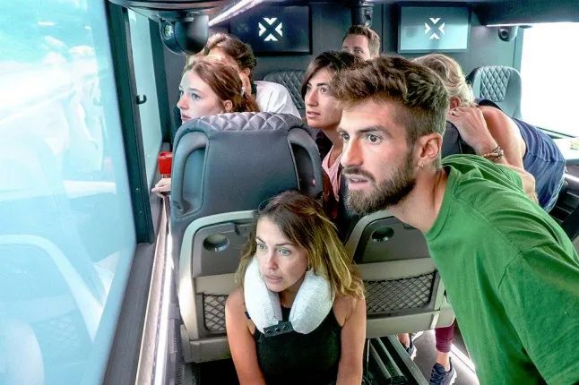 Contestants on a bus. Because that's where the show takes place. On a bus.