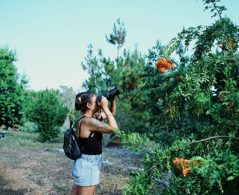 My incredible fiancée Cassandra taking pretty flower pictures 