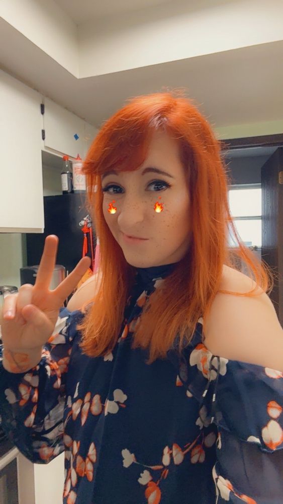 a selfie or myself in navy blue asymmetrical dress with exposed soldiers and a floral print