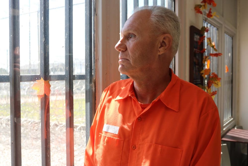 Wayne Thompson looks out the window of the Joseph Harp Correctional Center in Lexington. Thompson was convicted of first-degree murder in 1984 for a crime he committed at age 15.