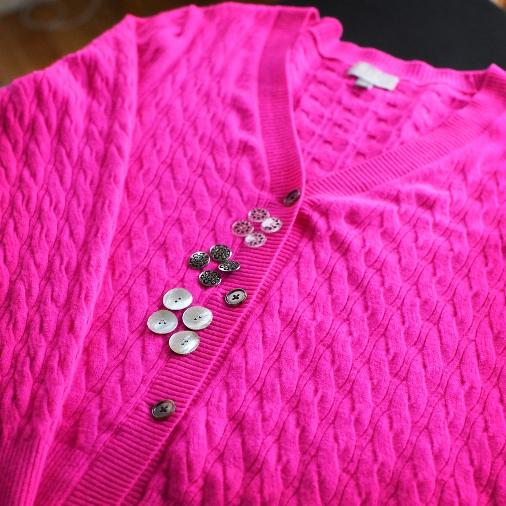 photo of the same sweater with three different button options
