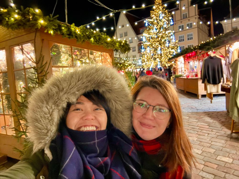 Two women taking selfie at a Christmas market in Tallinn Estonia