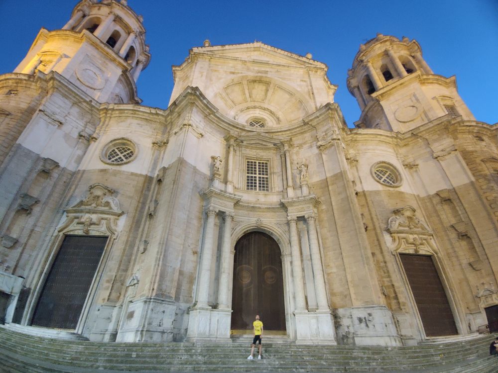 Ronny stands in front of the enormous new cathedral. There's a distinct line running horizontally through the building. When it was started stone from the local seabed was used but as construction was underway it was beset with issues that pushed up the cost. The upper half had to be completed using cheaper limestone.

You can see empty alcoves where statues should have been put and the windows are plain.

It took 100 years to complete.

Regardless the cathedral is really impressive and the turrets are one of the most recognisable features of the skyline