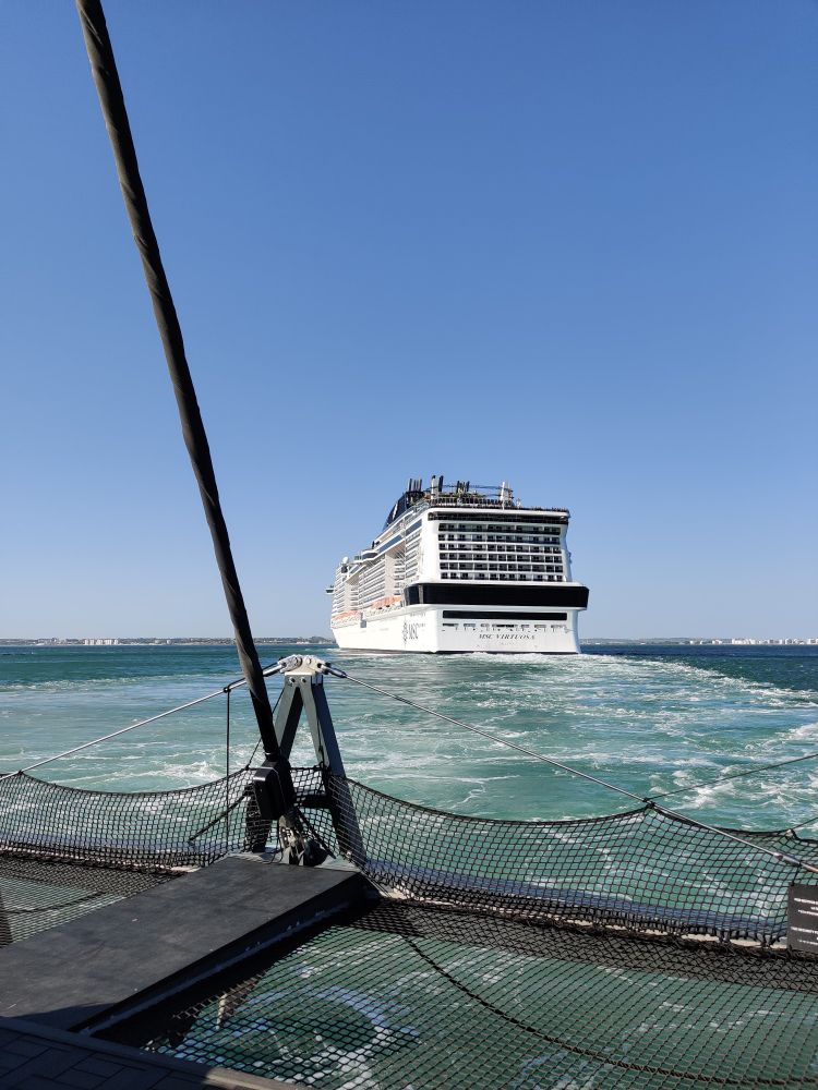 The back of a huge cruise ship. Our boat had to wait until it had left the harbour and then we followed in it's wake
