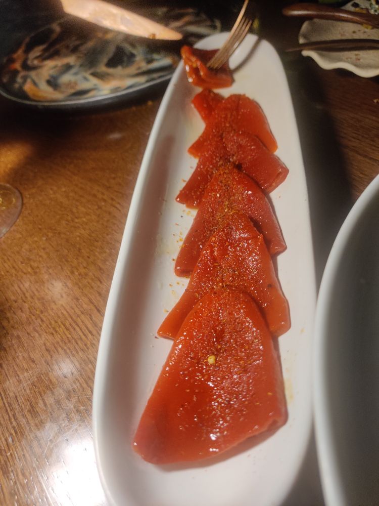 Roasted red peppers. They look like tongues on a plate